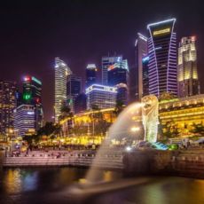 Singapore's skyline dazzles at night with vibrant lights and stunning architecture.