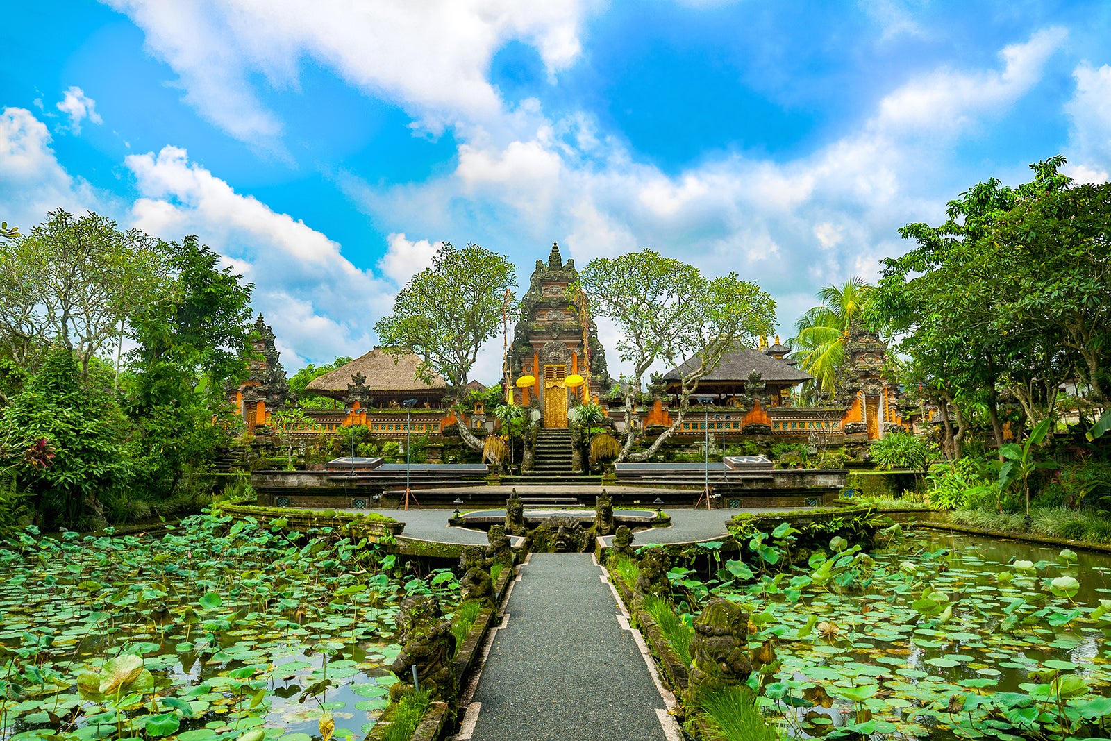 Explore the serene Ubud Temple in Bali with Atria Tourist—intricate architecture and lush views await!