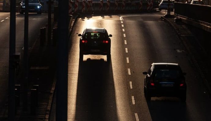 Cars cruise the sunset highway, revealing stunning views from top tour agency Atria Tourist.